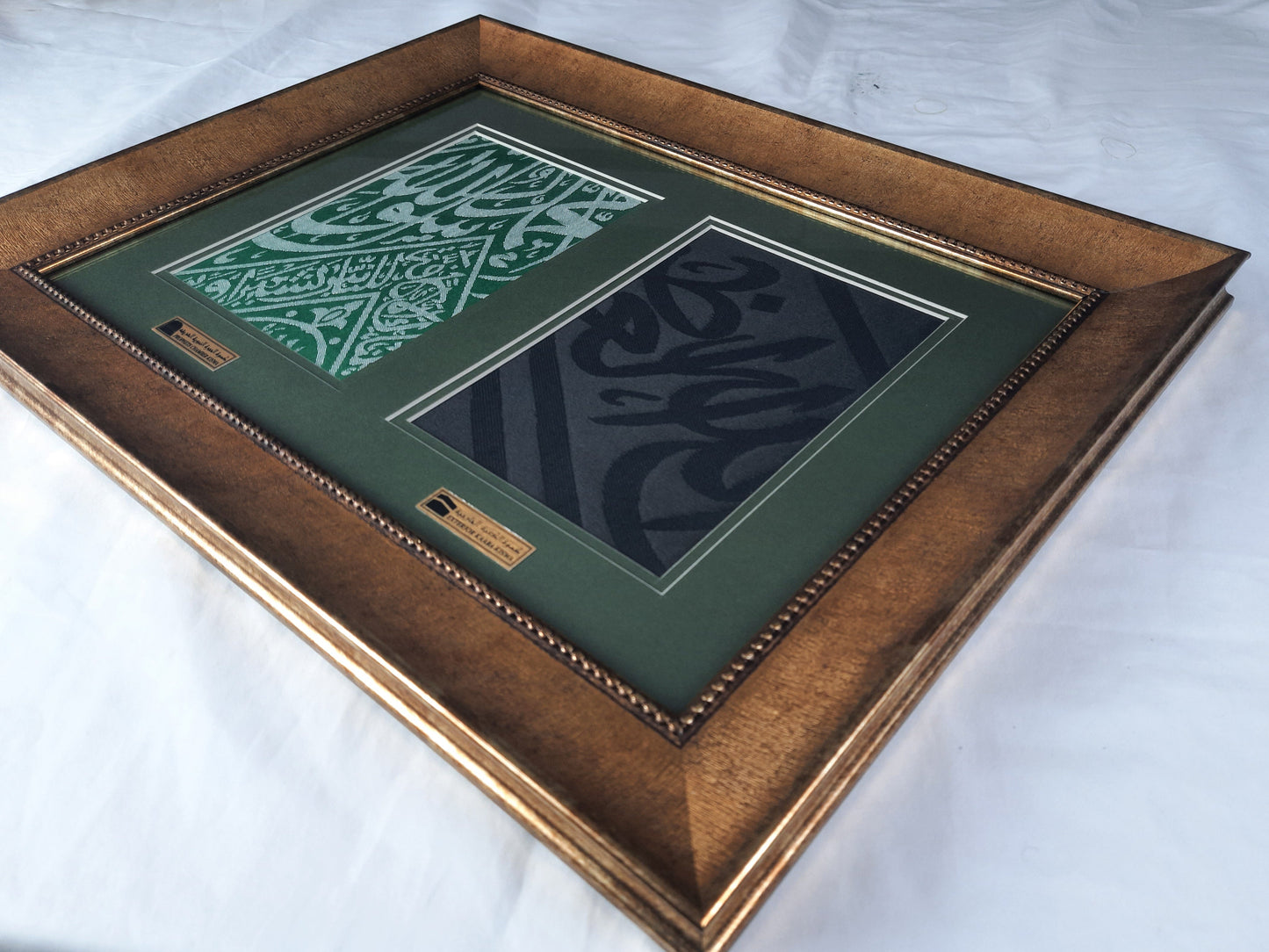 Wooden frame with decorative green artwork on a white background